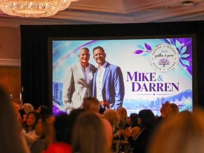 Audience watching a screen that shows Darren and Mike at the Dream Team Gather and Grow 2026 in Vancouver